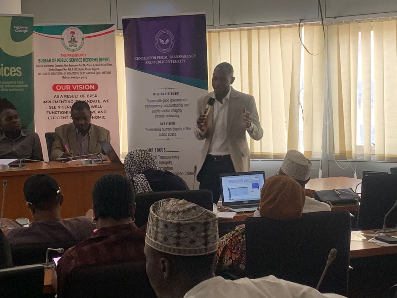 A speaker addressing the room during opening remarks
