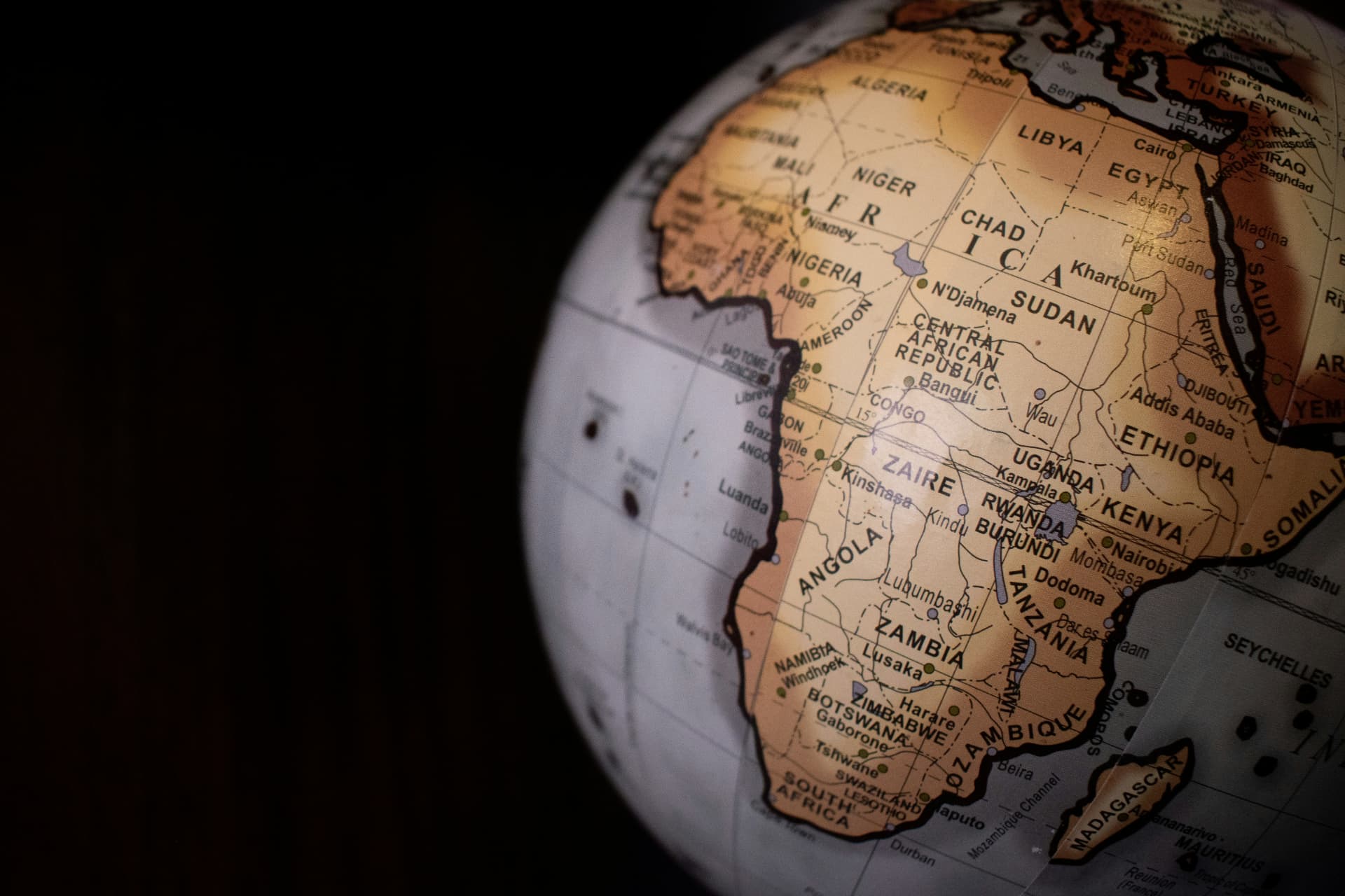 Illuminated globe centred on Africa showing country names and borders (stock photo)