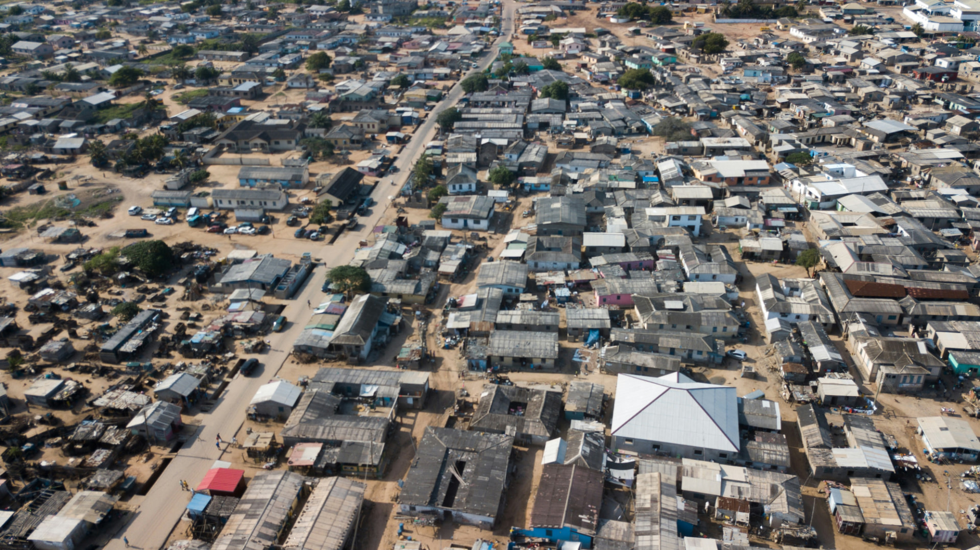 Aerial view of a densely built settlement with sandy streets and small houses (stock photo)