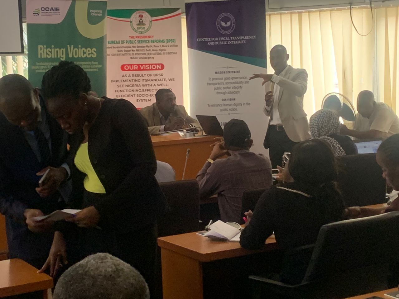 A participant standing to speak during the session